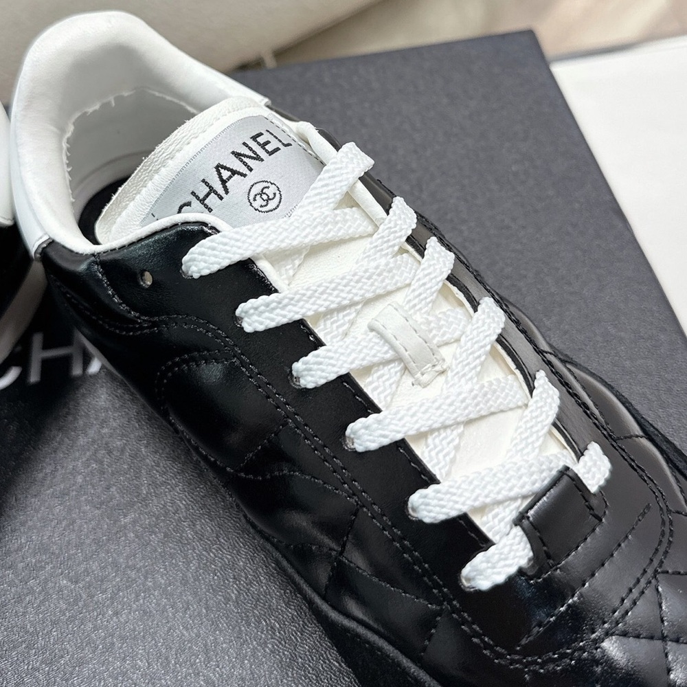 Women's Chanel Black Quilted Patent Leather White Lace-Up Sneakers - Picture 5 of 7